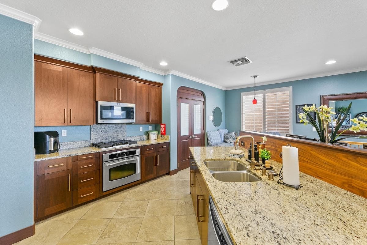 2nd Floor kitchen - custom walnut cabinetry and bar. Gas cooker.